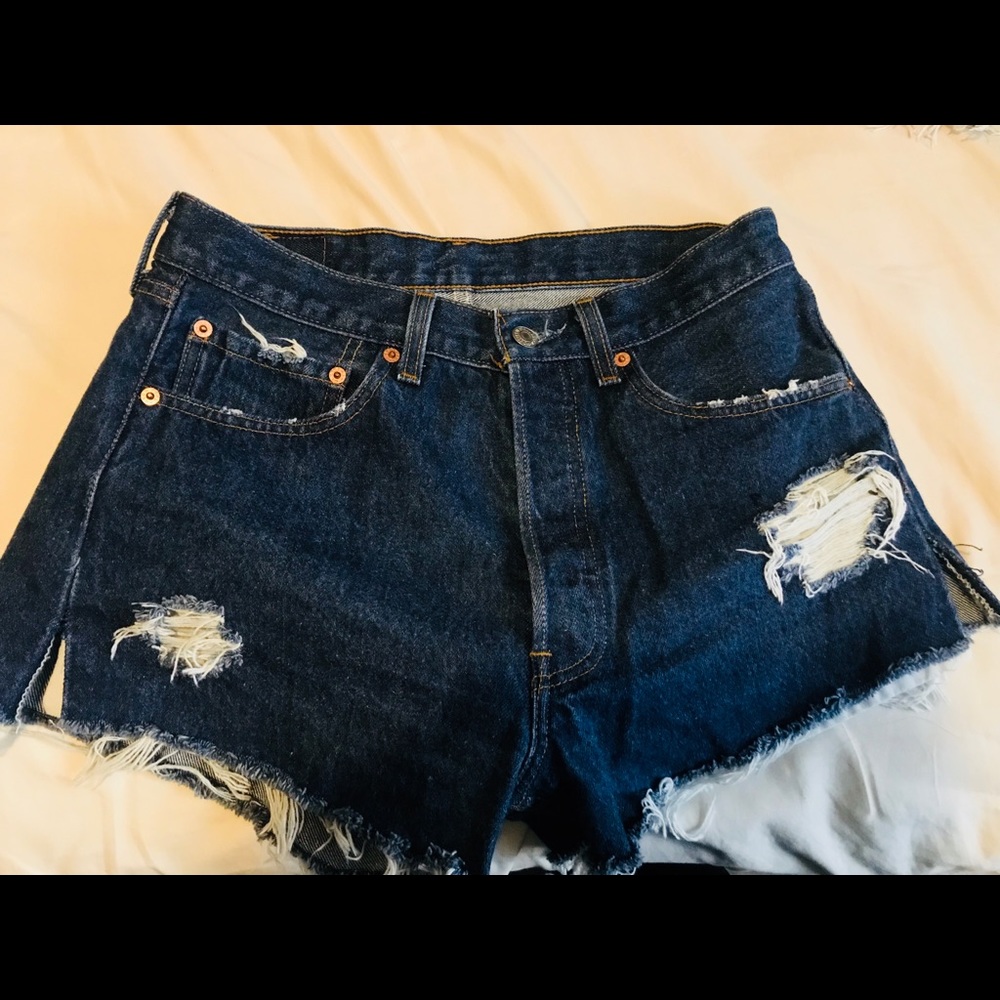 Dark Wash Destroyed Blue Denim Levi’s cutoffs